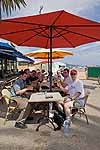 Band members relaxing with a beer after a boat cruise