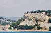 Cassis with a mansion overlooking it from a nearby hilltop