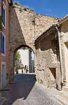 Gate in an old stone wall in Beaumes-de-Venise