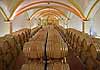 Wine barrels aging at a winery in Beaumes-de-Venise