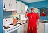 J.R. with a beer in his kitchen