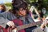 Dee playing guitar at her cottage