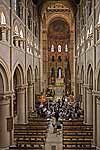 The Blarney Brass and Reed band warms up in St. Fin Barre's Cathedral, Cork