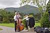 A couple of band members warm up for an outdoor concert at Muckross House in Killarney National Park