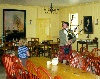An interpretive guide playing the bagpipes in the great hall at Old Fort William, Thunder Bay
