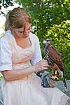 A young falconer pets a hawk at the 2010 Casa Loma Renaissance Festival